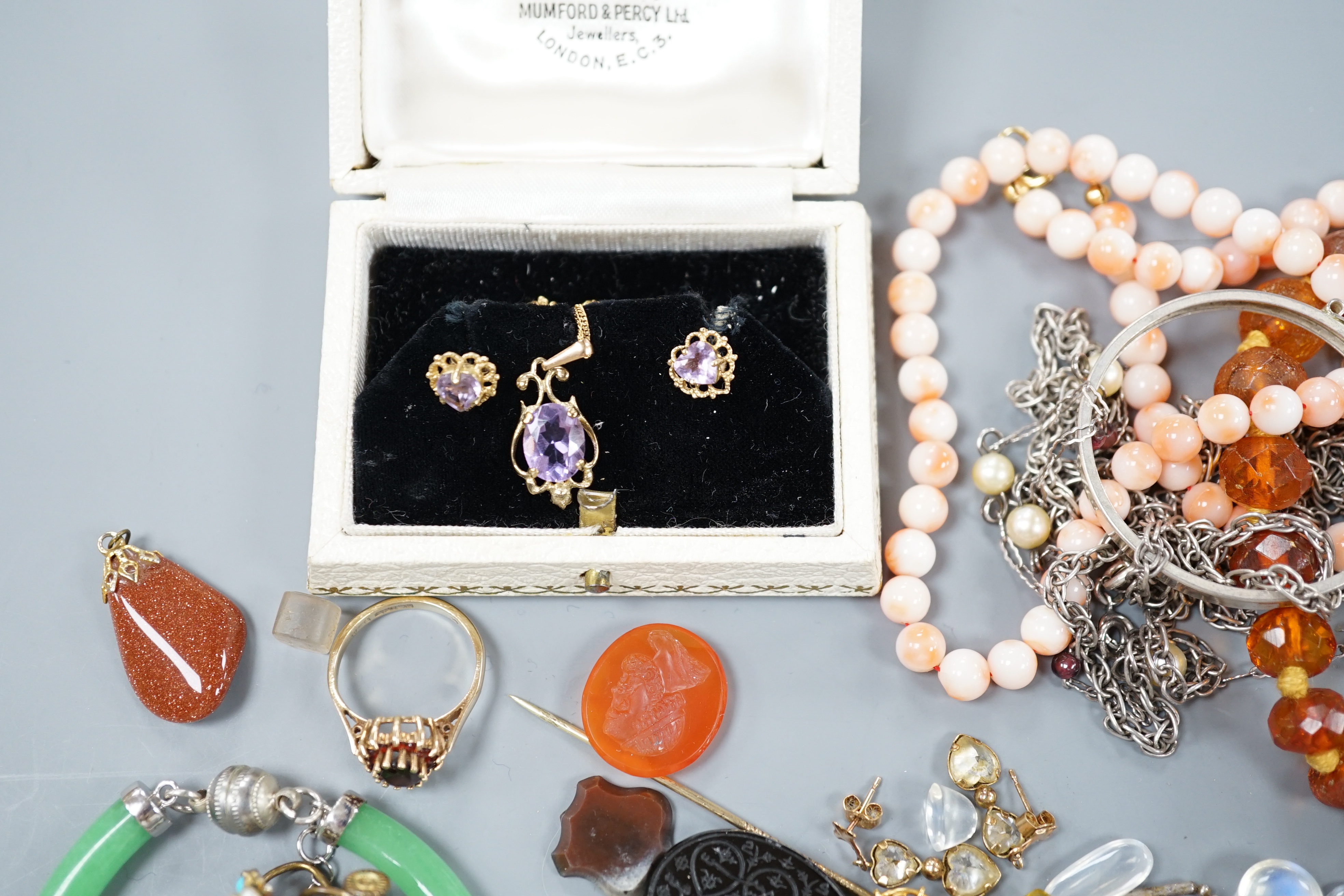 An amethyst pendant on gold chain and other gold and silver jewellery etc.